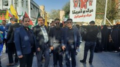 حضور همکاران اداره‌کل امور اقتصادی و دارایی قم در مراسم یوم‌الله ۱۳ آبان